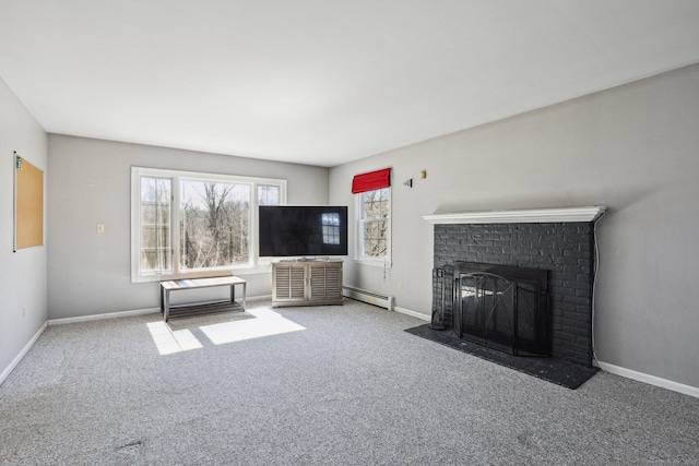 unfurnished living room featuring baseboard heating, a fireplace, baseboards, and carpet