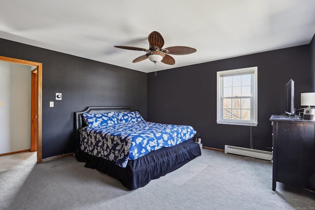 carpeted bedroom featuring a ceiling fan, baseboards, and a baseboard radiator