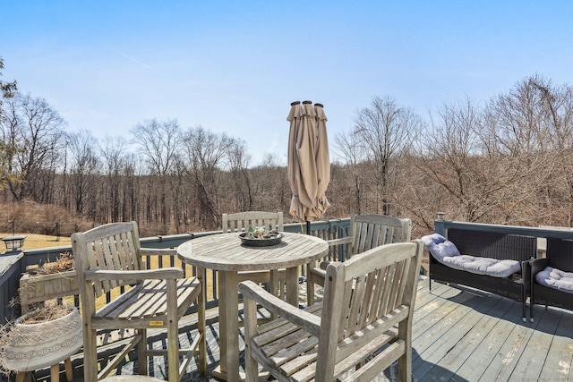 deck featuring a view of trees