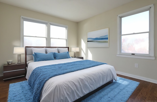 bedroom with dark wood-type flooring and baseboards