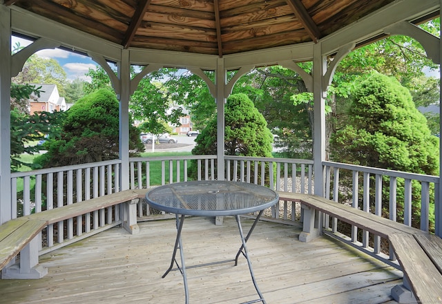 wooden terrace featuring a gazebo