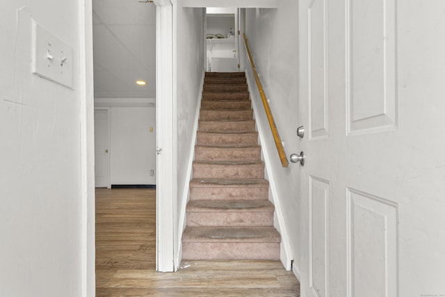 staircase featuring wood finished floors