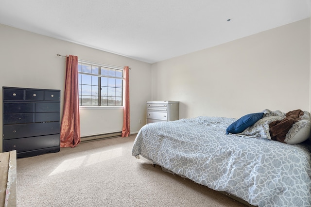 carpeted bedroom with a baseboard heating unit