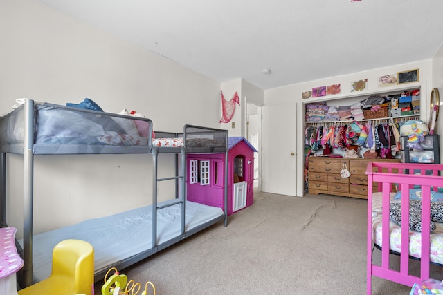 carpeted bedroom featuring a closet