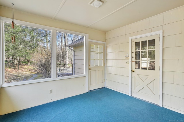 unfurnished sunroom with visible vents