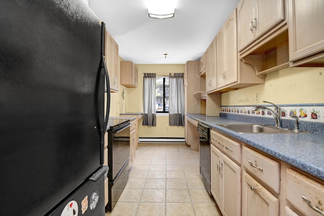 kitchen featuring black appliances, light tile patterned floors, dark countertops, and a sink