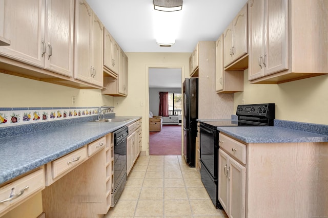 kitchen featuring black appliances, light brown cabinetry, a sink, light tile patterned flooring, and light colored carpet