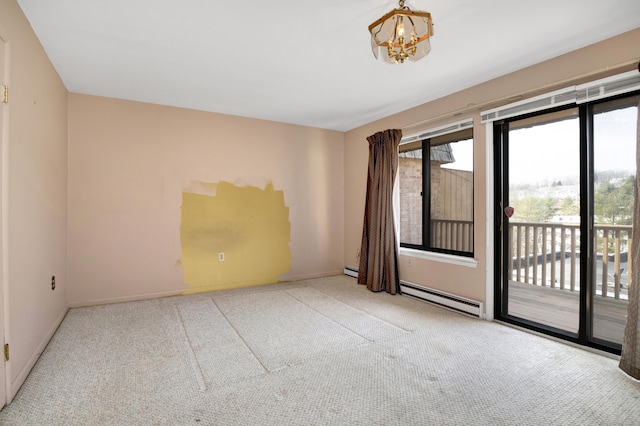 carpeted empty room with a baseboard radiator, baseboards, and an inviting chandelier