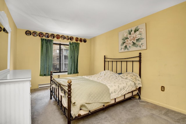 carpeted bedroom with a baseboard radiator and baseboards