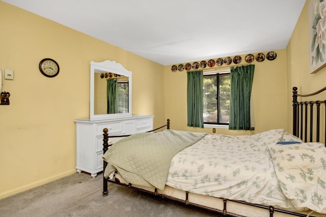 bedroom featuring carpet flooring and baseboards