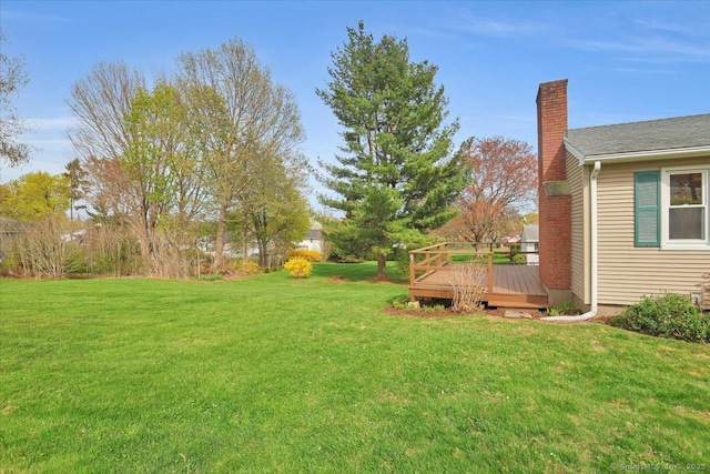 view of yard with a deck