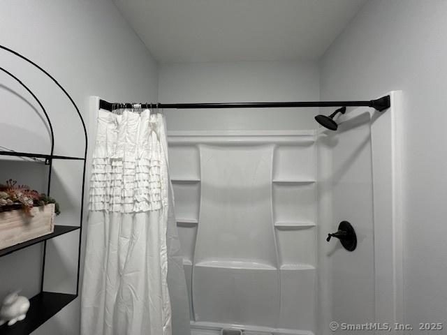 bathroom with curtained shower