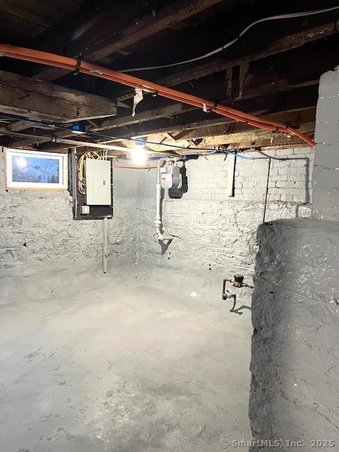 unfinished basement with electric panel