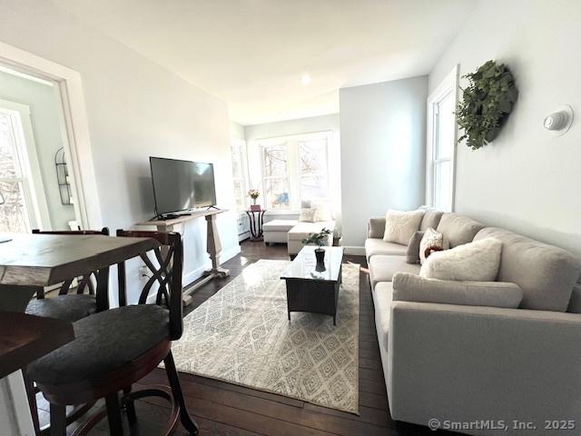 living room with dark wood-type flooring