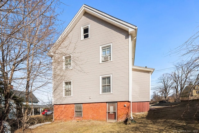 back of house featuring cooling unit