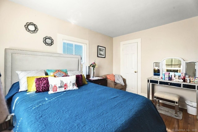 bedroom with wood finished floors