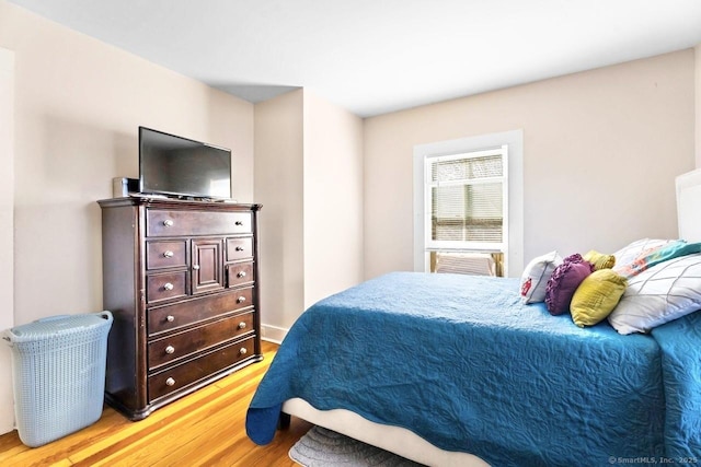 bedroom with light wood-style floors