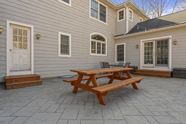 view of patio / terrace with outdoor dining space and entry steps