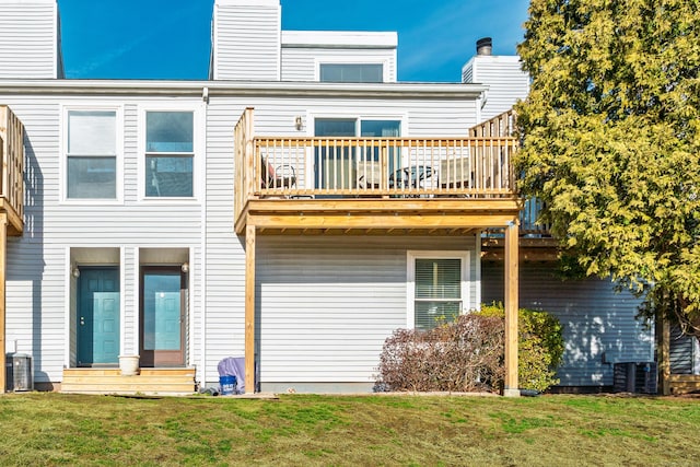 rear view of property featuring central AC unit, a lawn, entry steps, and a chimney