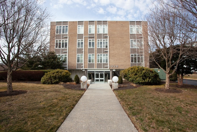 view of building exterior with concrete driveway