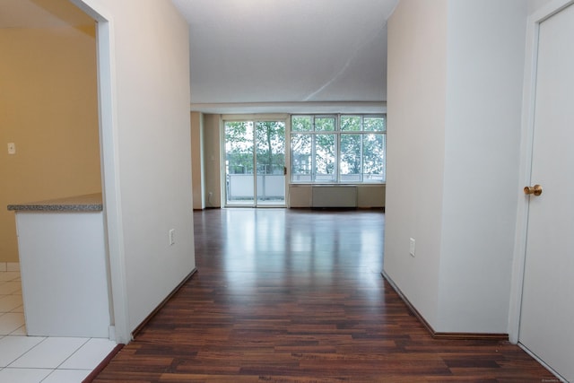 hall with wood finished floors
