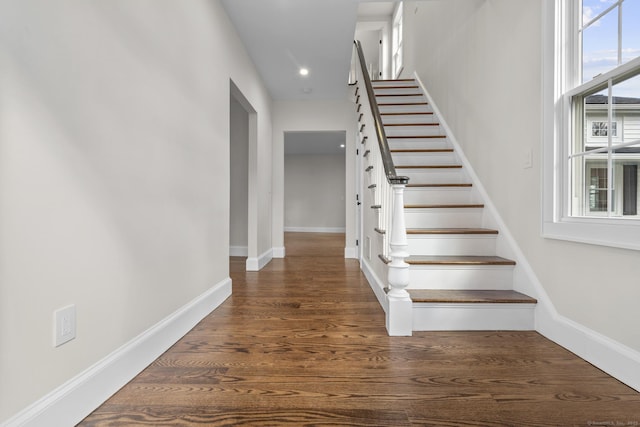 stairs featuring recessed lighting, baseboards, and wood finished floors