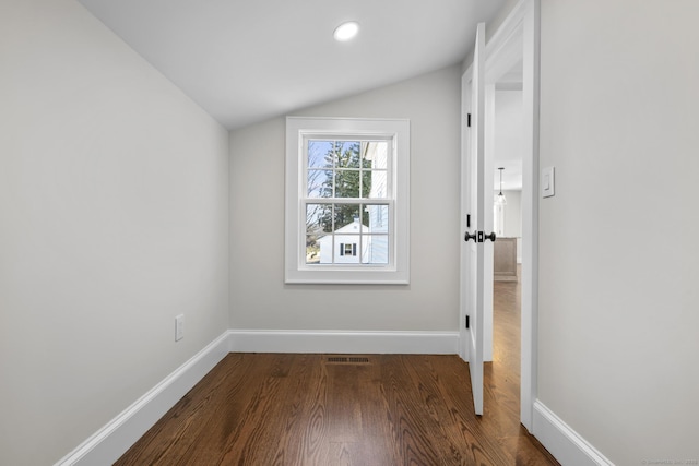 interior space featuring dark wood-style floors, baseboards, visible vents, lofted ceiling, and recessed lighting