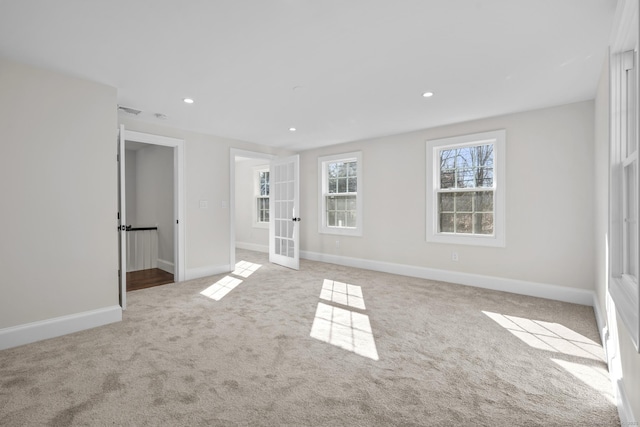 unfurnished bedroom featuring recessed lighting, french doors, baseboards, and carpet floors