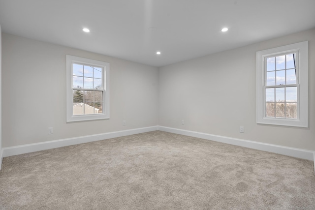 carpeted spare room with recessed lighting and baseboards