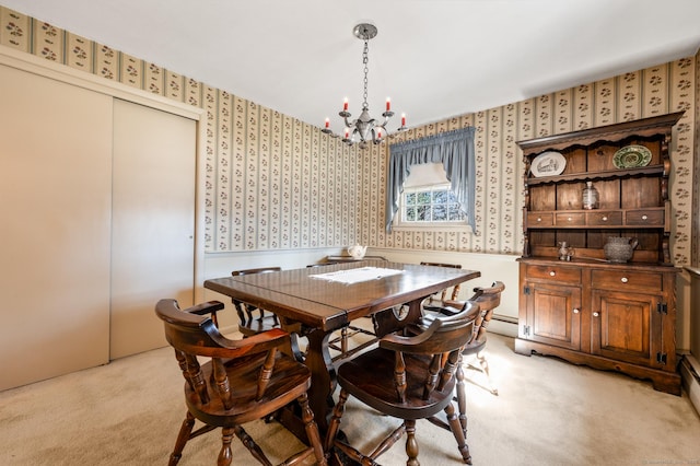 dining space featuring light carpet, a notable chandelier, and wallpapered walls