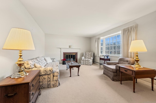 living area with light carpet and a fireplace