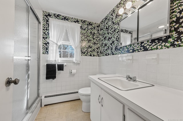 full bath featuring toilet, a stall shower, tile walls, wallpapered walls, and a baseboard radiator