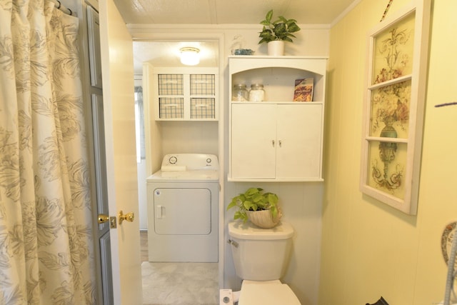 laundry room with washer / clothes dryer and cabinet space