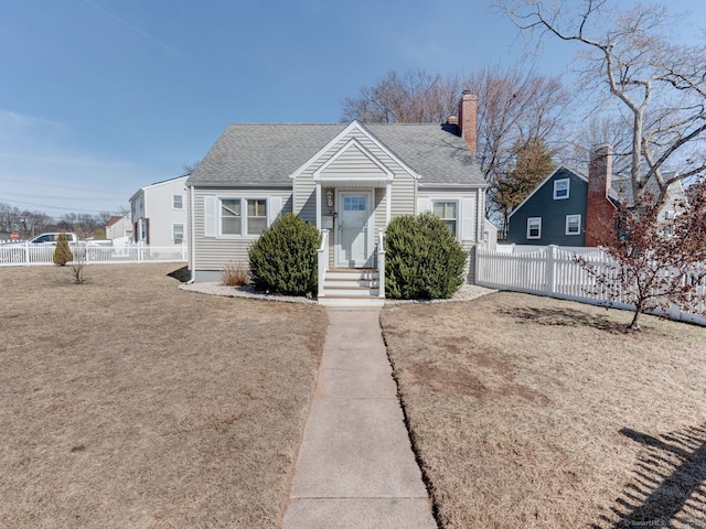 bungalow-style home with a chimney, a shingled roof, and fence