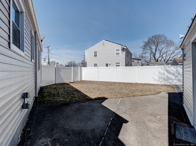 view of yard featuring a patio and a fenced backyard