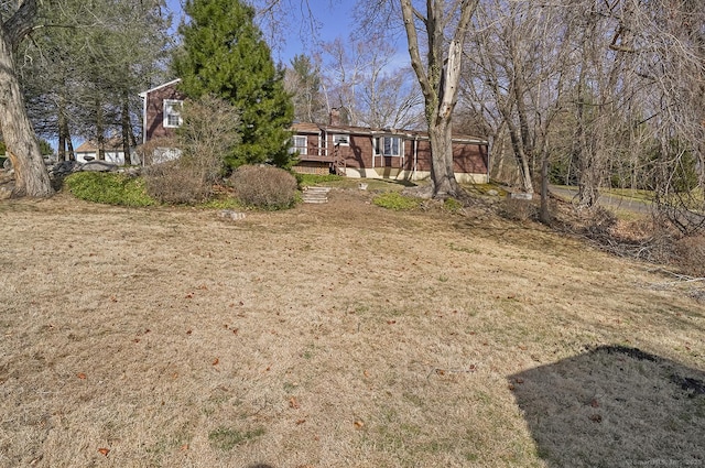 view of yard with a wooden deck