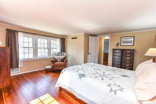 bedroom featuring visible vents and wood-type flooring