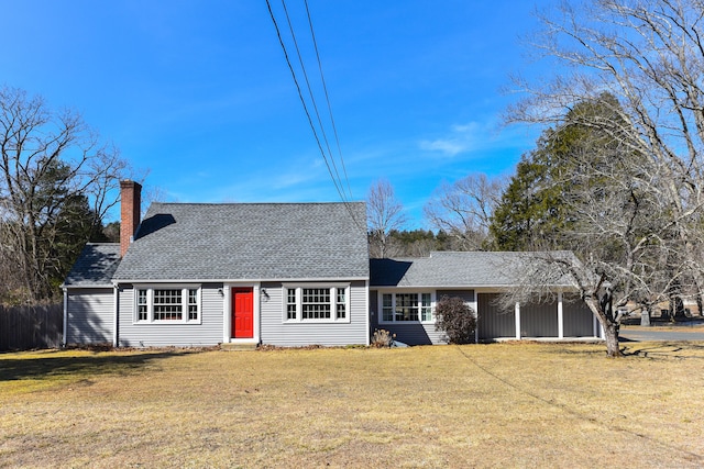 cape cod home featuring a chimney, a front lawn, and roof with shingles