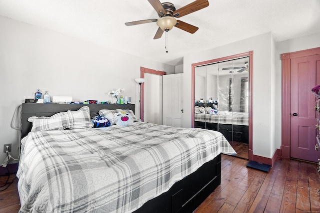 bedroom with baseboards, dark wood-type flooring, and a ceiling fan