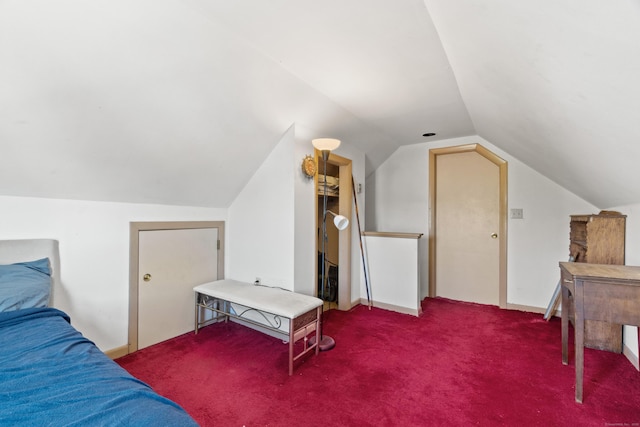 bedroom with carpet and vaulted ceiling