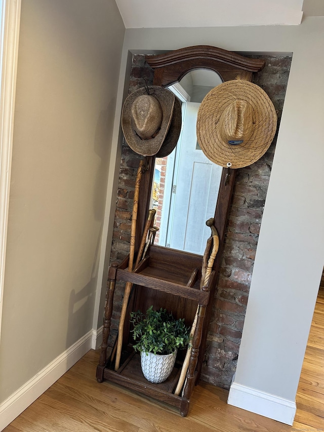 room details featuring baseboards and wood finished floors