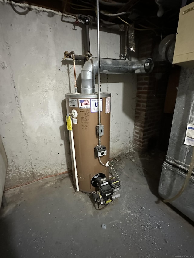 utility room featuring gas water heater