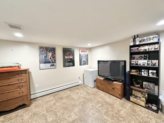 recreation room with a baseboard heating unit, recessed lighting, and visible vents