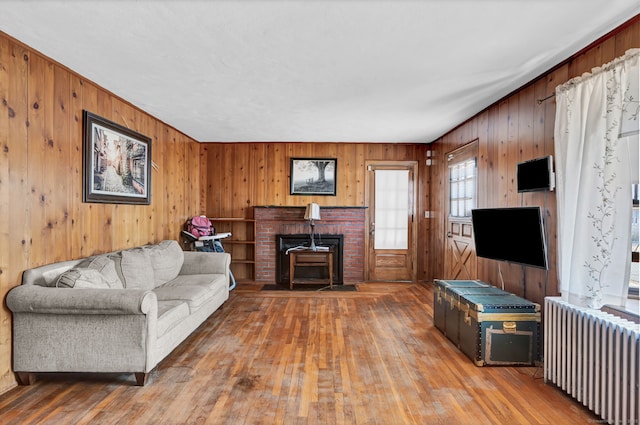 living room featuring radiator heating unit and hardwood / wood-style floors