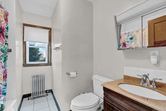 bathroom with tile patterned flooring, baseboards, toilet, radiator heating unit, and vanity