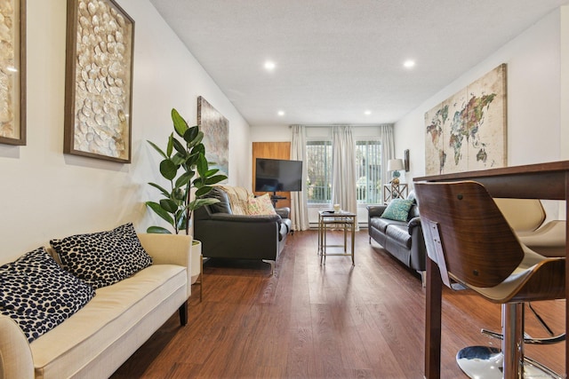 living area with recessed lighting and wood finished floors