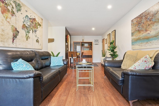 living room featuring recessed lighting and wood finished floors