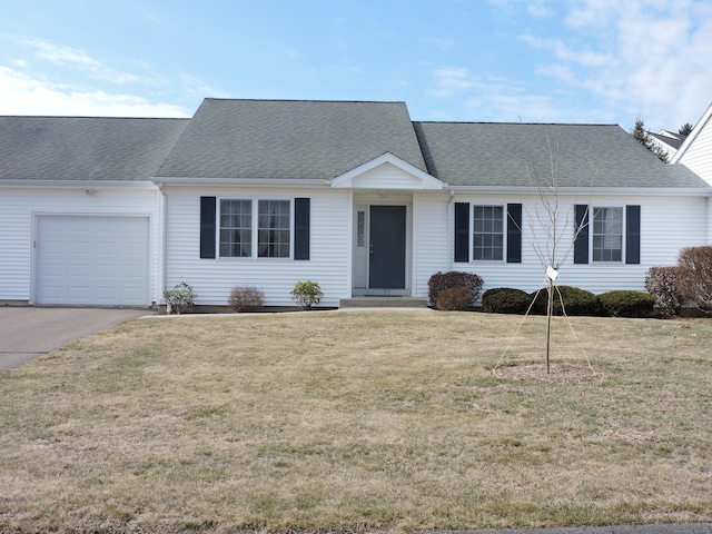 ranch-style house featuring a front lawn, concrete driveway, a garage, and a shingled roof