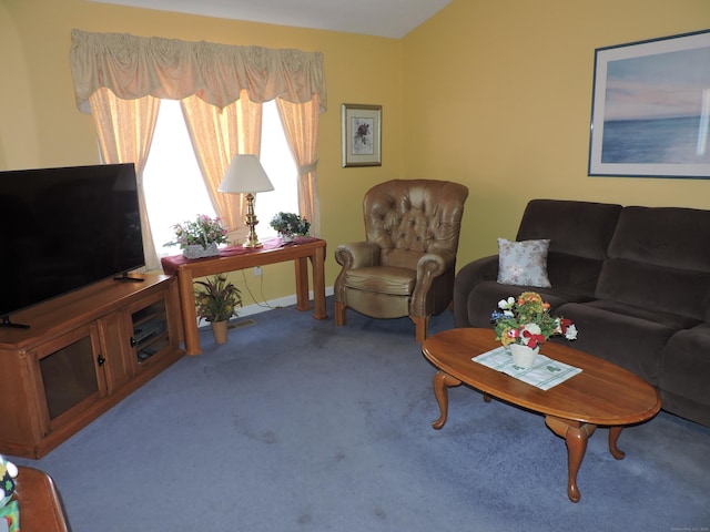 carpeted living area with baseboards