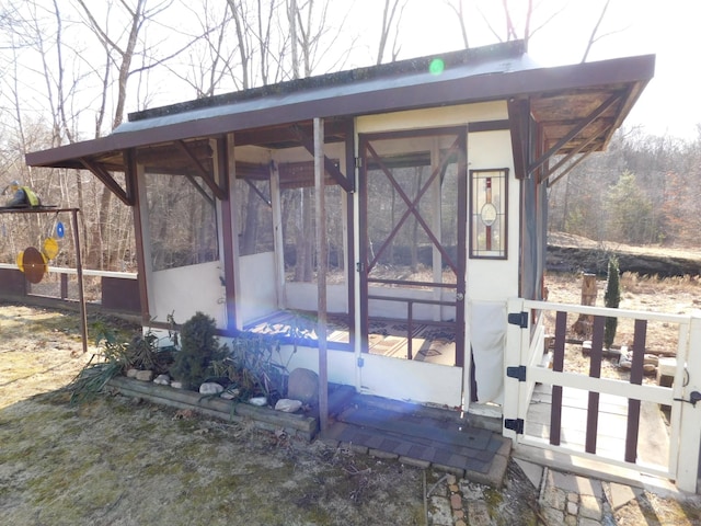 exterior space with a sunroom